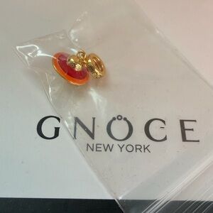 Gold and Red space ship Gnoce Charm